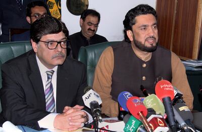 Pakistani Minister of State for Interior Shehryar Afridi, right, and Pakistan's Interior Secretary Azam Suleman Khan give a press conference in Islamabad, Pakistan, Tuesday, March 5, 2019. Khan said that authorities arrested dozens of suspects in the wake of last month's suicide bombing in Indian-controlled Kashmir that killed 40 Indian troops, including the brother of the leader of the outlawed Jaish-e-Mohammad militant group. (AP Photo/A.M. Chaudary)