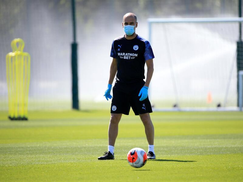 MANCHESTER, ENGLAND - MAY 25: Manchester City's Pep Guardiola in action during training at Manchester City Football Academy on May 25, 2020 in Manchester, England. (Photo by Tom Flathers/Manchester City FC via Getty Images)