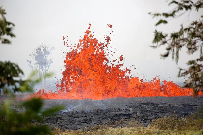 Lava erupts on the outskirts of Pahoa during ongoing eruptions of the Kilauea Volcano in Hawaii. Terray Sylvester / Reuters
