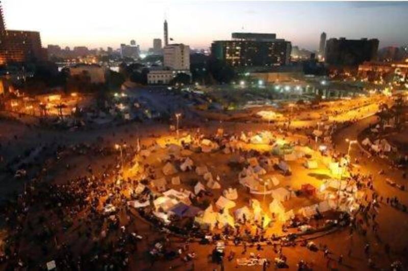 Protesters gather to demonstrate against President Mohammed Morsi in Tahrir Square. Regional businesses continue to feel the fallout from Egypt's political rivalries. Mahmoud Khaled / AFP