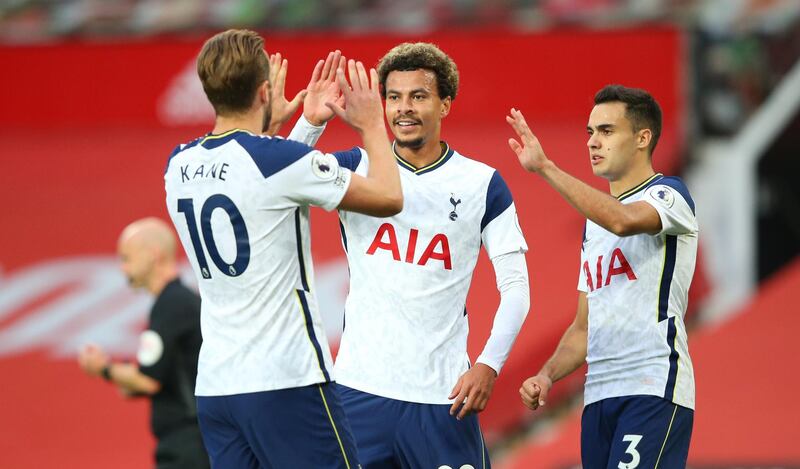 MANCHESTER, ENGLAND - OCTOBER 04: Harry Kane of Tottenham Hotspur celebrates with teammates Dele Alli and Sergio Reguilon after scoring his sides sixth goal during the Premier League match between Manchester United and Tottenham Hotspur at Old Trafford on October 04, 2020 in Manchester, England. Sporting stadiums around the UK remain under strict restrictions due to the Coronavirus Pandemic as Government social distancing laws prohibit fans inside venues resulting in games being played behind closed doors. (Photo by Alex Livesey/Getty Images)