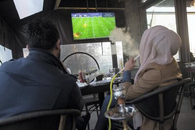 Nur Mohammad, 35, was on his ideal date with his fianc��, Suma Abu Raid, as they watch Palestine play Jordan in the Asia Cup 2018 held in Abu Dhabi as they sit in the Jasmine Cafe in the West Bank City of Nablus on January 15,2018. The game was a tie 0-0 .(Photo by Heidi Levine for The National).