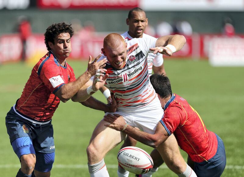 Dubai, United Arab Emirates - December 1st, 2017: James Rodwell of England is tackled during the game between Spain and England at the 2nd Day of Dubai Rugby 7's. Friday, December 1st, 2017 at The Sevens, Dubai. Chris Whiteoak / The National