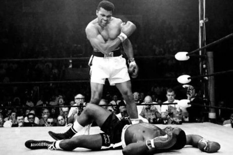 Muhammad Ali stands over the fallen Sonny Liston in 1964, in the fight that made him heavyweight champion of the world for the first time. AP Photo / John Rooney