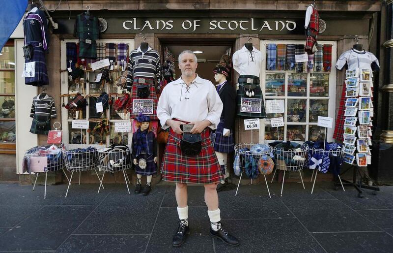 Souvenir merchant Steve Wright poses outside his shop, Clans of Scotland, in Edinburgh. Mr Wright, who plans on voting “Yes” to independence, says he thinks “The word ‘no’ should not be in the Scottish vocabulary this year.” Suzanne Plunkett / Reuters