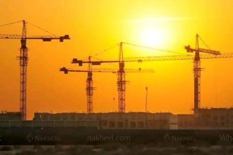 Cranes stand idle at the Dubai Waterfront project in 2009. Charles Crowell / Bloomberg News