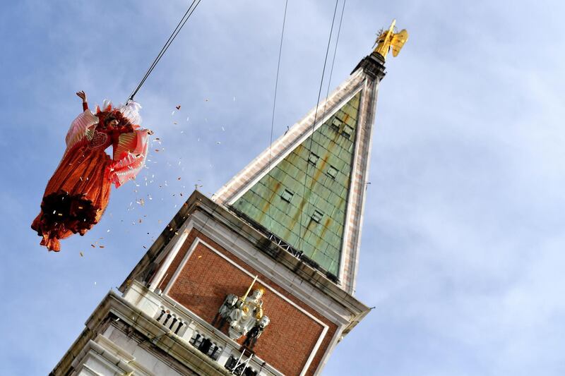 The "angel" Linda Pani performs as the Angel of the new Carnival by the Bell Tower on St Mark's Square in Venice.  AFP
