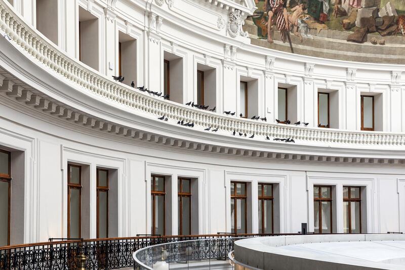 Stuffed pigeons form an artwork by Maurizio Cattelan entitled 'Others' on the third-floor balcony of the Bourse de Commerce. Bloomberg