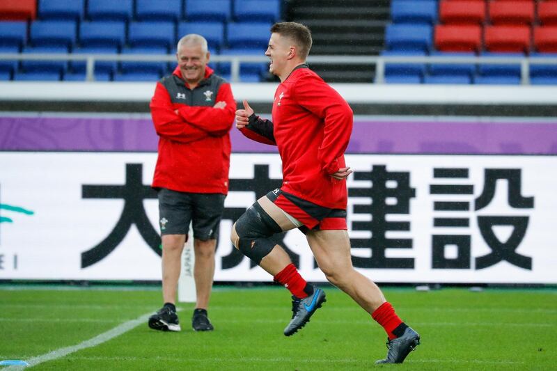 Wales head coach Warren Gatland, left, watches on as Jonathan Davies participates in training session. EPA