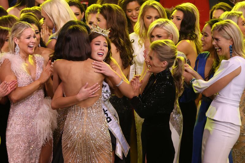 Miss Alaska Emma Broyles is embraced by contestants after being announced as the winner. Reuters