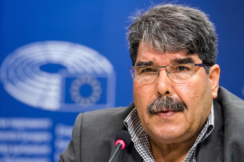 FILE - In this Sept. 1, 2016 file photo, then co-chair of the Syrian Kurdish Democratic Union Party (PYD) Salih Muslim addresses journalists at the European Parliament in Brussels. Turkey's official news agency, Anadolu, and a Syrian Kurdish official said Sunday, Feb. 25, 2018, that Czech authorities have detained Muslim under an Interpol red notice based on Ankara's request for his arrest. Muslim was put on Turkey's most-wanted list earlier in February with a reward for $1 million. (AP Photo/Geert Vanden Wijngaert, File)