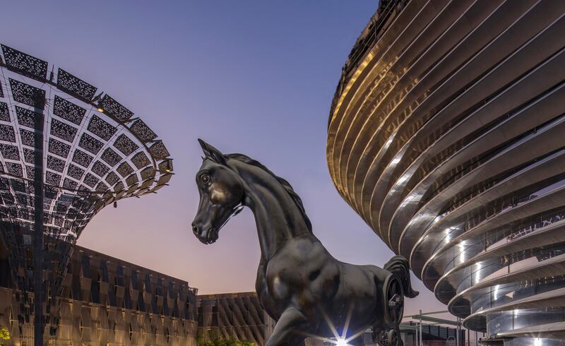 The 'Mare and Foal' statue at the Mobility Pavilion, photographed at sunrise.