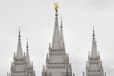 The gold Moroni statue atop the historic Salt Lake City Mormon Temple. The LDS Church is known for its striking places of worship. AFP / Getty