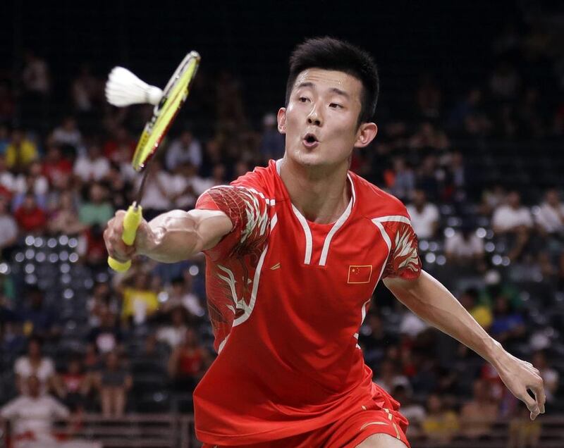Chen Long of China returns a shot to Son Wan Ho of South Korea during a men’s singles quarter-final badminton match. Kin Cheung / AP Photo