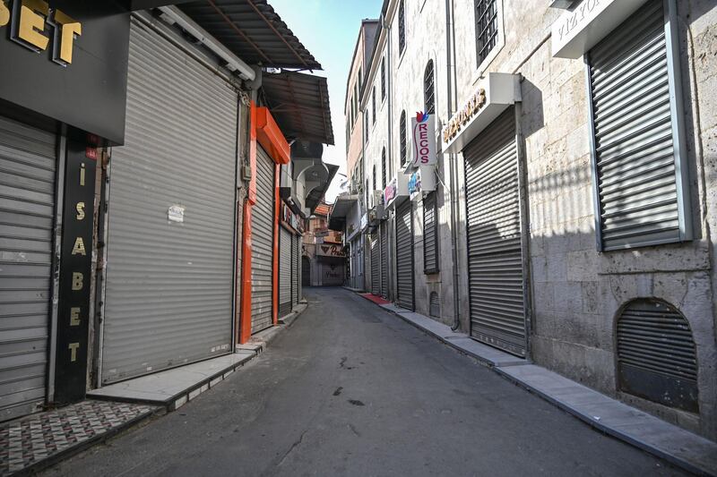 Closed shops in a deserted street in Istanbul. AFP