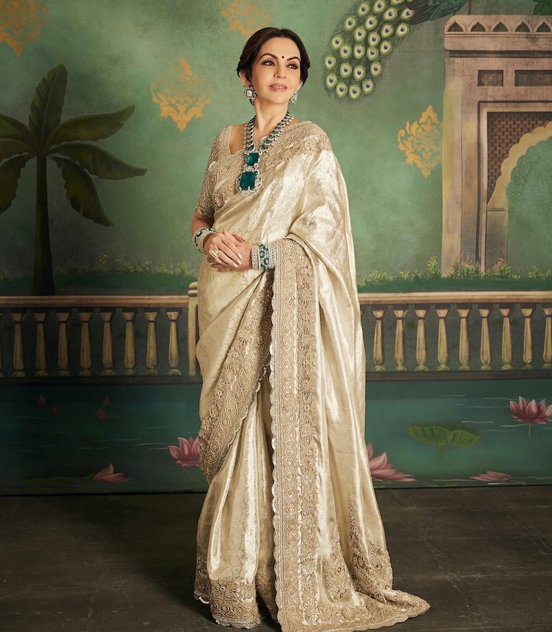 Nita Ambani chose a more traditional look for the night, wearing a Kanchipuram sari, renowned the world over for its fine silk weaves. Malhotra and his team then added traditional zardosi, or elaborate embroidery, to the border of the sari, giving it a regal look. Photo: @manishmalhotra05 / Instagram