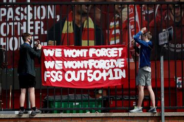 Soccer Football - Liverpool fans protest against owners after failed launch of a European Super League - Anfield, Liverpool, Britain - April 24, 2021 Liverpool fans put up a banner during the protest Action Images via Reuters/Carl Recine