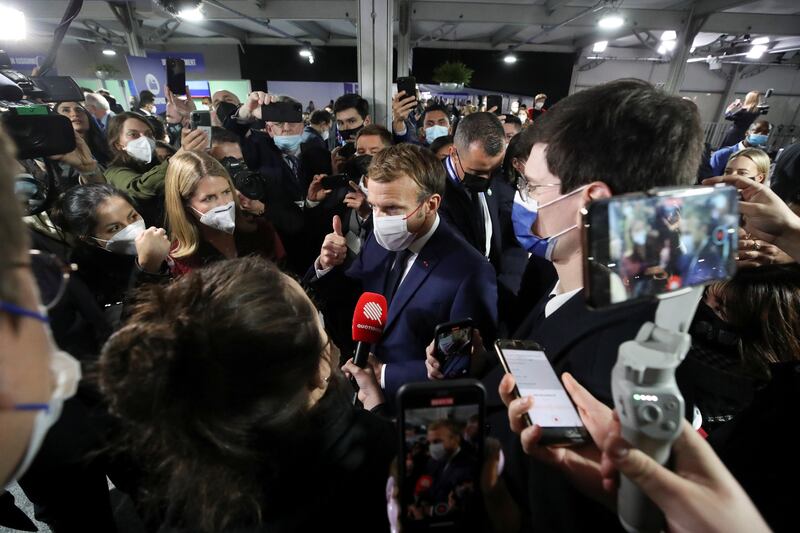Emmanuel Macron speaks to reporters. Reuters