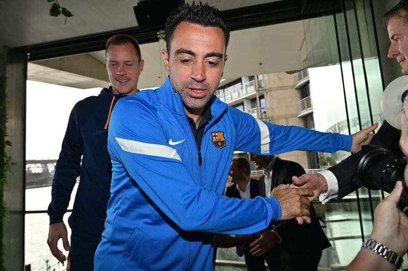Xavi Hernandez leaves the press conference in Sydney on the eve of Barcelona's friendly match against A-League All Stars. AFP