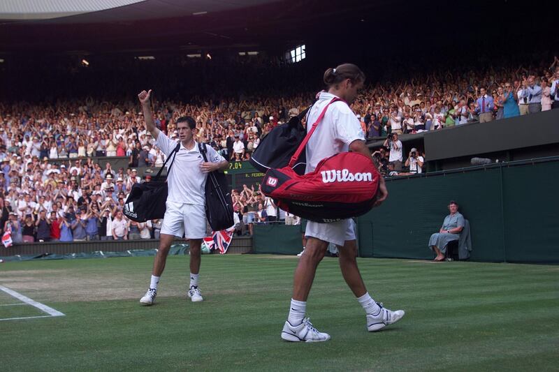 4 Jul 2001:  Tim Henman of Great Britain waves to the crowd after beating Roger Federer of Switzerland during the men's quarter finals of The All England Lawn Tennis Championship at Wimbledon, London.  DIGITAL IMAGE Mandatory Credit: Gary M. Prior/ALLSPORT/Getty Images