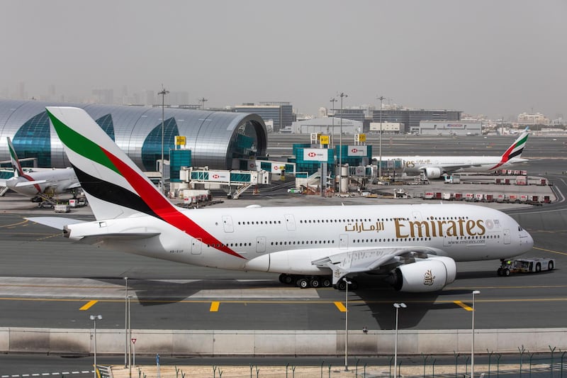 An Airbus SE A380-800 aircraft, operated by Emirates, taxis past the terminal.