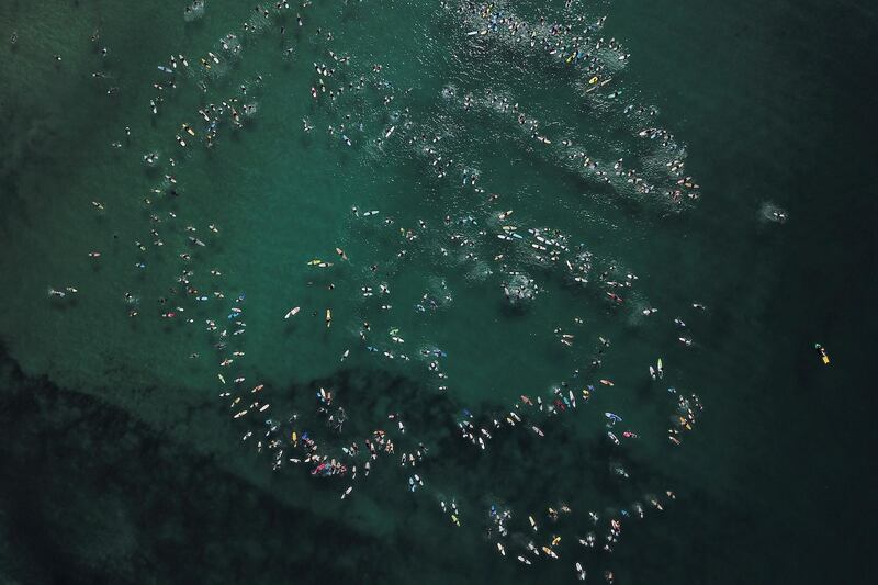 More than 600 surfers take part in a world record attempt paddle out at 'The Farm' National Surfing Reserve on the New South Wales south coast in Australia, on Saturday, May 1. EPA