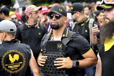 Proud Boys Chairman Enrique Tarrio rallies in Portland, Ore., during the group's "End Domestic Terrorism" gathering on Saturday, Aug. 17, 2019. (AP Photo/Noah Berger)