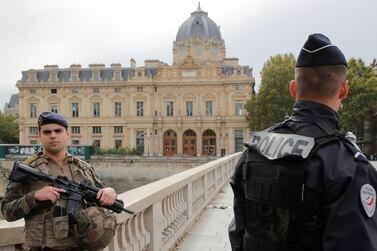 French police secure the area in front of the Paris Police headquarters. Reuters