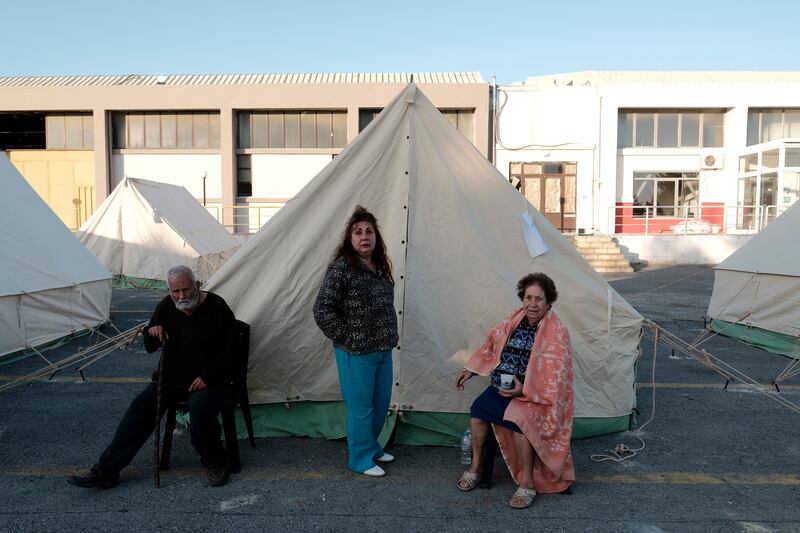 Residents outside their tents in Arkalochori village on the southern Greek island of Crete. Photo: AP