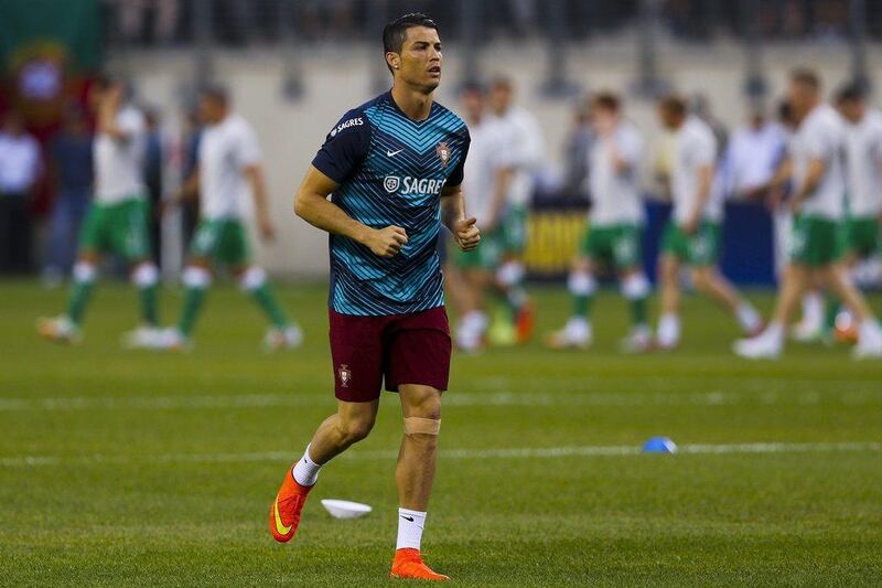 Portugal's Cristiano Ronaldo warms up before Tuesday night's international friendly against Ireland as the Portuguese prepare for the 2014 World Cup in Brazil. Jose Sena Goulao / EPA / June 10, 2014