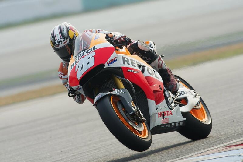 Dani Pedrosa of Spain and Repsol Honda lifts his front wheel during Day 2 of MotoGP testing at Sepang International Circuit on February 27, 2014. Mirco Lazzari / Getty Images