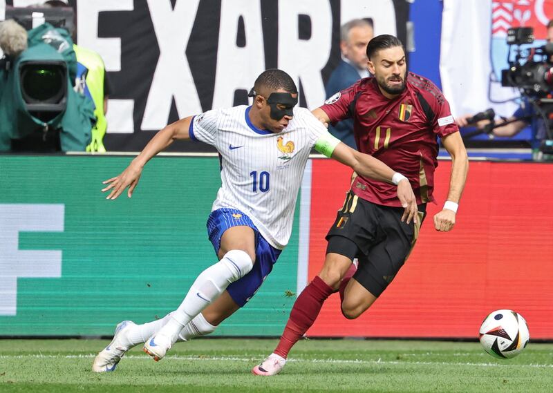 Kylian Mbappe of France and Yannick Carrasco of Belgium in action. EPA 