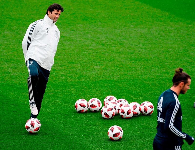 Santiago Solari, left, watches over Real Madrid forward Gareth Bale. AFP
