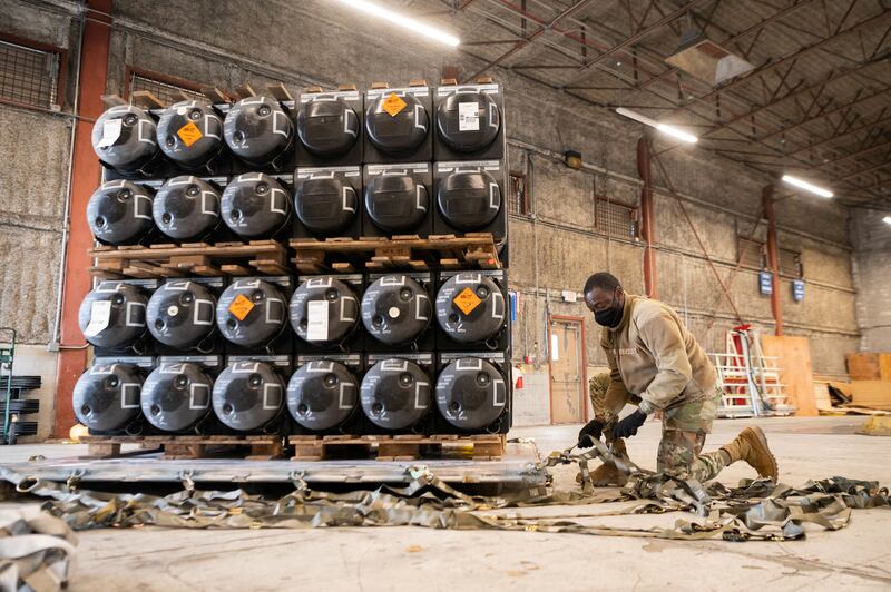 A member of the US Air Force packs ammunition, weapons and other equipment bound for Ukraine, at Dover Air Force Base, Delaware. Reuters
