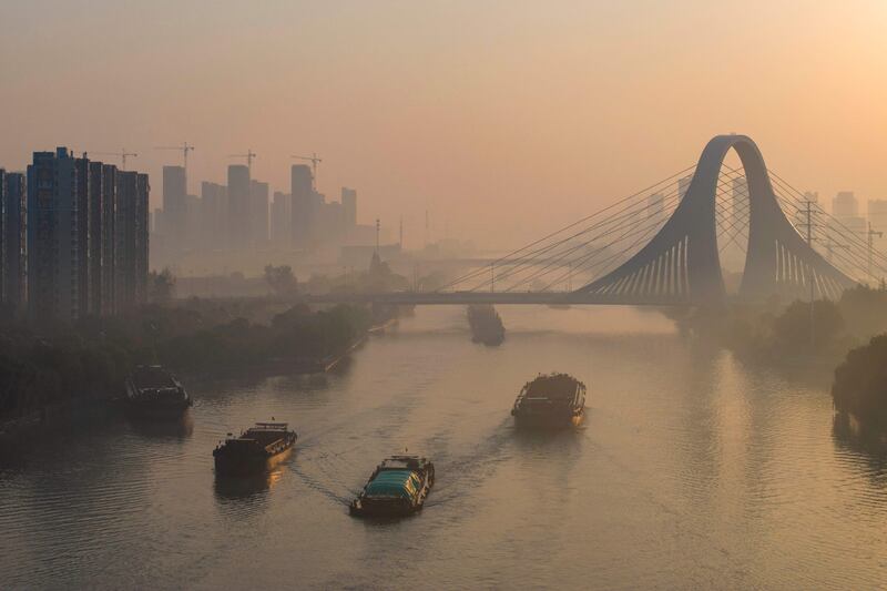 Barges sail on the Grand Canal in Huaian, in China's eastern Jiangsu province on October 26, 2023.  (Photo by AFP)  /  China OUT