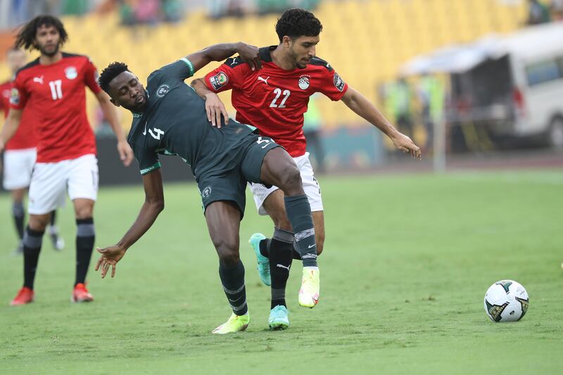 Nigeria's Wilfred Ndid and Omar Marmpush of Egypt fight for the ball. AP