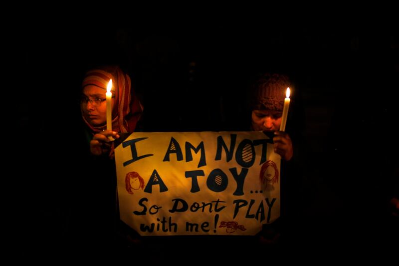 Indians hold a candle light vigil to salute the undying spirit of a rape victim as well as urge the government to make several key reforms to ensure safety of women, in New Delhi, India , Sunday, Dec. 30, 2012. The young woman who died after being gang-raped and beaten on a bus in India's capital was cremated Sunday amid an outpouring of anger and grief by millions across the country demanding greater protection for women from sexual violence. (AP Photo/ Saurabh Das) *** Local Caption ***  India Gang Rape.JPEG-0d6db.jpg