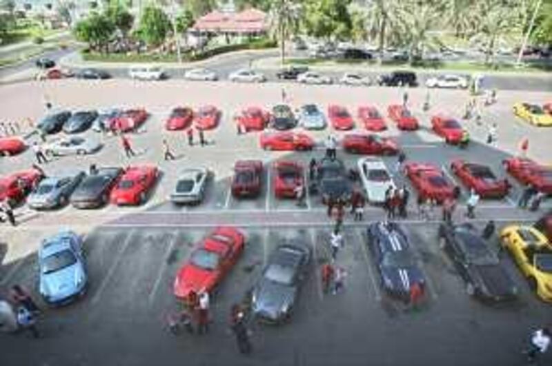 United Arab Emirates - Abu Dhabi - Oct. 30 - 2009 : A convoy of Ferrari cars driven by members of the UAE Ferrari Owner’s Club is parked at Poltrona Frau showroom. The convoy depart from Dubai to Abu Dhabi in the morning and drive along the Abu Dhabi Corniche up to the Crowne Plaza hotel on Al Yas Island to the Formula 1 race. ( Jaime Puebla / The National ) *** Local Caption ***  JP Ferrari 01.jpg