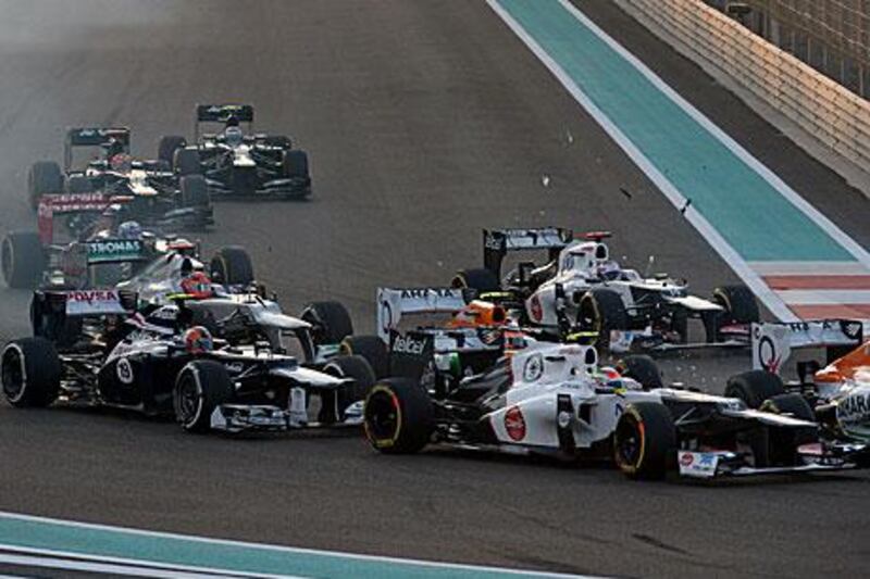 Force India's Nico Hulkenberg clips Sauber's Sergio Perez at the start of the grand prix.