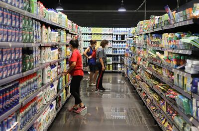 Women check for prices inside a supermarket in Beirut in September. Reuters