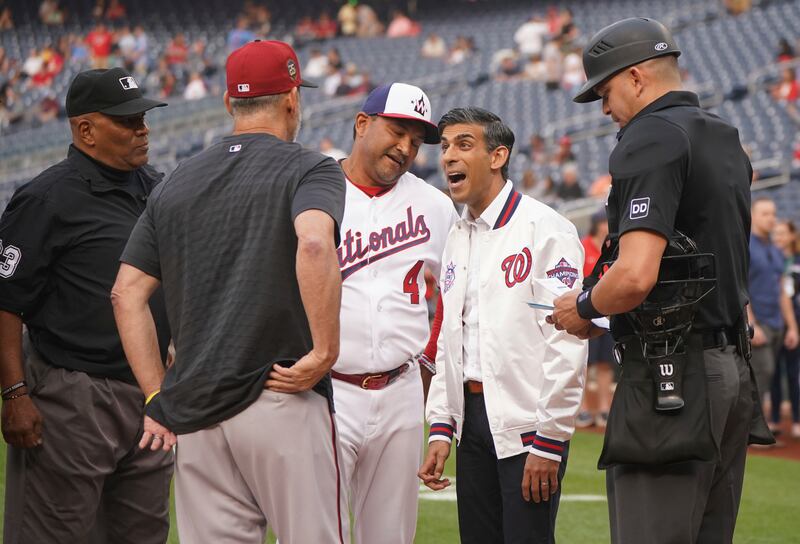 Washington Nationals Manager, David Martinez introduces British Prime Minister Rishi Sunak to umpires. AP