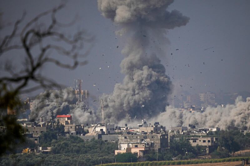 Smoke billows over Gaza after an air strike, as seen from southern Israel. AP