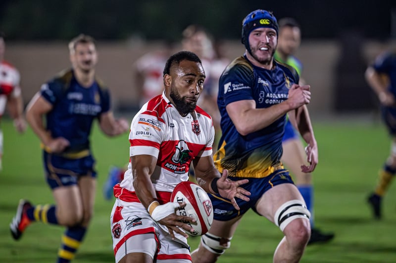 Sakiusa Naisau, left, makes a break for Dubai Tigers in their win over Doha in the West Asia Premiership at the Tigers Park on Friday. All images Antonie Robertson / The National