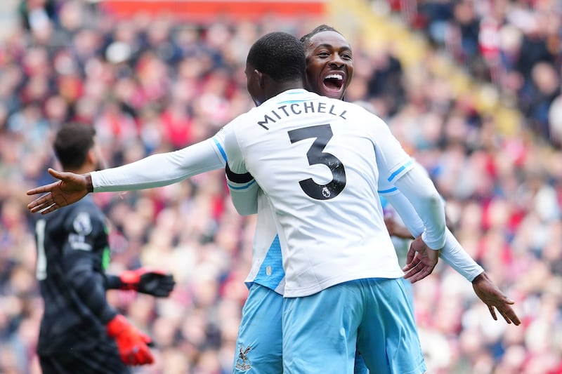 Crystal Palace's Eberechi Eze celebrates with Crystal Palace's Tyrick Mitchell after scoring his side's winning goal in the 1-0 Premier League victory against Liverpool at Anfield on Sunday, April 14, 2024. AP