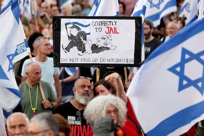 A banner depicting Israeli Prime Minister Benjamin Netanyahu is held up as activists rally during an anti-government demonstration in Tel Aviv on Saturday. AFP