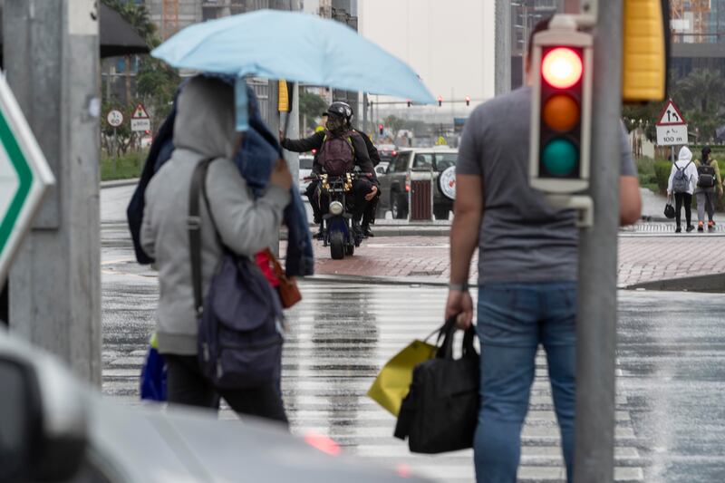 Residents had umbrellas at the ready on a rainy Sunday in Dubai. Antonie Robertson / The National