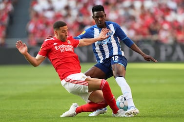 Benfica's Adel Taarabt vies for the ball with Porto's Zaidu Sanusi, right, during the Portuguese league soccer match between SL Benfica and FC Porto at the Luz stadium in Lisbon, Saturday, May 7, 2022.  (AP Photo / Pedro Rocha)