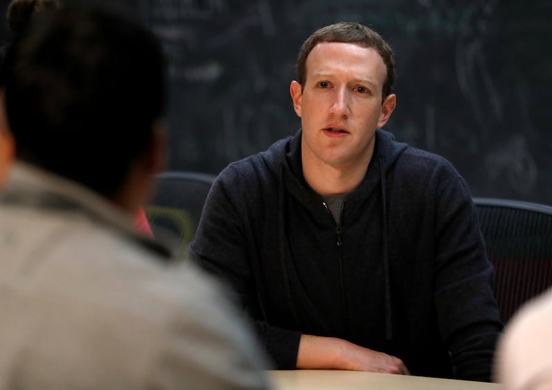 File-This Nov. 9, 2017, file photo shows Facebook CEO Mark Zuckerberg meeting with a group of entrepreneurs and innovators during a round-table discussion at Cortex Innovation Community technology hub  in St. Louis. Facebook is announcing its second major tweak to its algorithm this month, saying it will prioritize news based on usersâ€™ votes. The company said in a blog post and Facebook post from Zuckerberg Friday, jan. 19, 2018,  that it will survey users about how familiar they are with a news source and if they trust it. (AP Photo/Jeff Roberson, File)