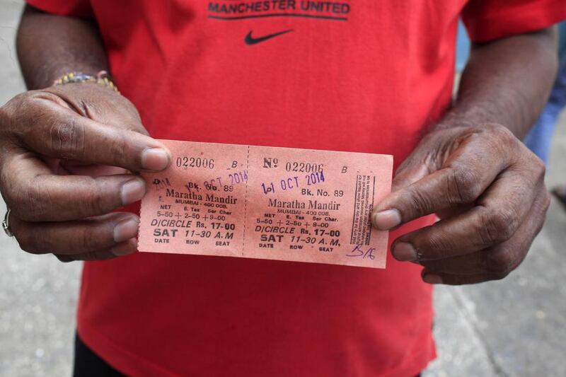 A fan holds up his ticket for DDLJ. Tickets cost 15 rupees (Dh1), which probably explains why the film is still so popular. Subhash Sharma for The National