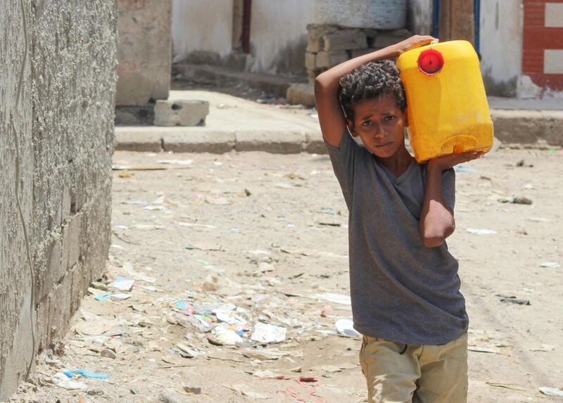 A Yemeni boy returns home after filling his jerrycan with water amid a severe shortage of water in southern Yemen's capital Aden, on April 30.
 Saleh Al-Obeidi / AFP